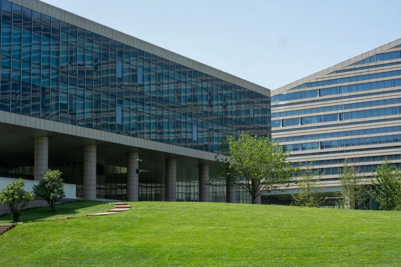 A landscaped commercial office property with mature trees in the Twin Cities